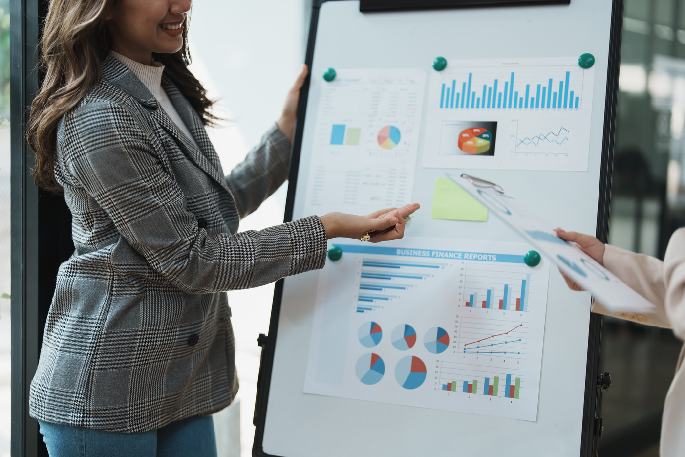 Financial analysts analyzing business reports on planned investm